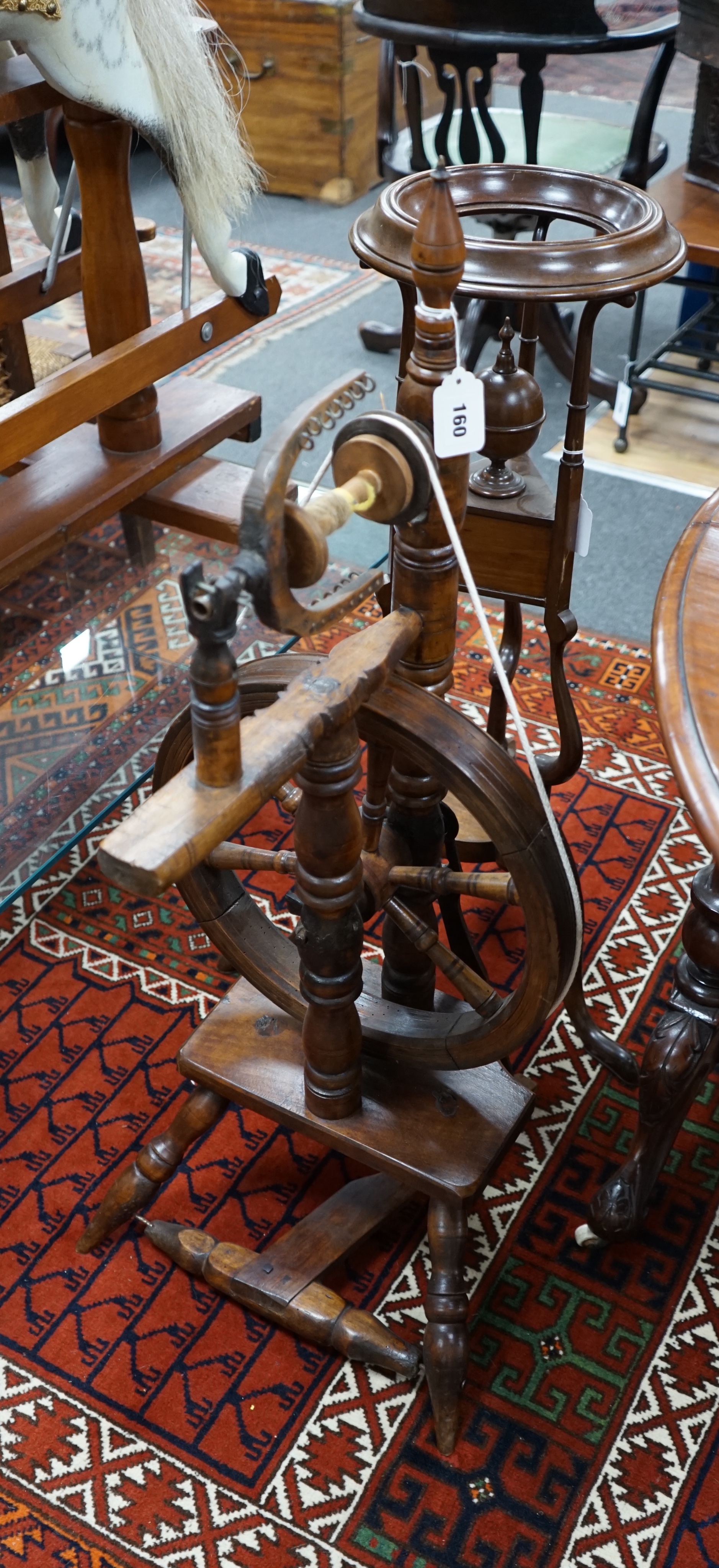 A turned fruitwood and beech spinning wheel, height 92cm together with a Georgian style wash stand